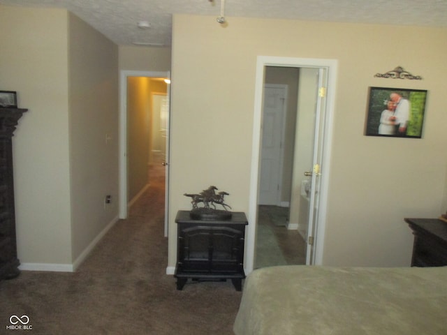 carpeted bedroom with a textured ceiling