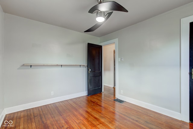 unfurnished bedroom featuring hardwood / wood-style floors and ceiling fan