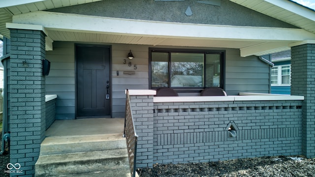 entrance to property featuring covered porch