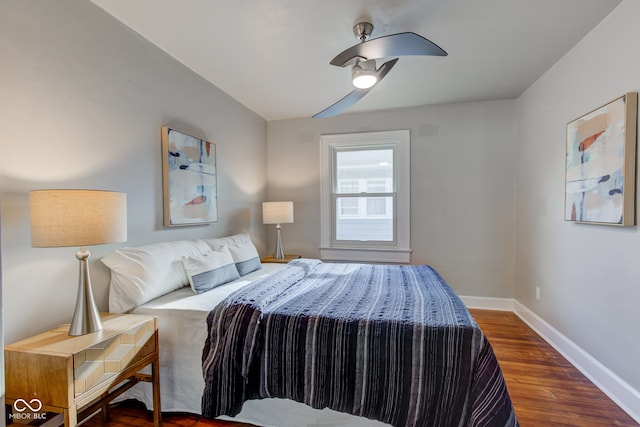 bedroom featuring ceiling fan and dark wood-type flooring