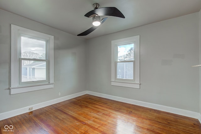 spare room with wood-type flooring and ceiling fan