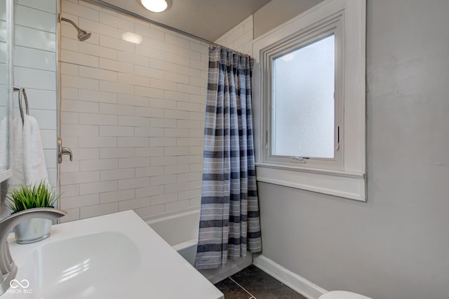 full bathroom featuring tile patterned floors, shower / bath combination with curtain, toilet, and sink