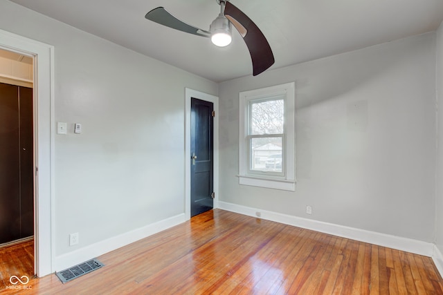 unfurnished bedroom featuring ceiling fan and wood-type flooring