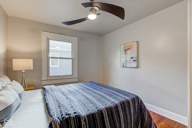 bedroom with hardwood / wood-style floors and ceiling fan