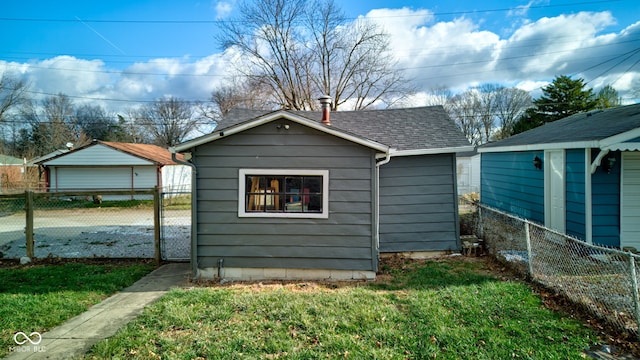 view of outbuilding featuring a yard