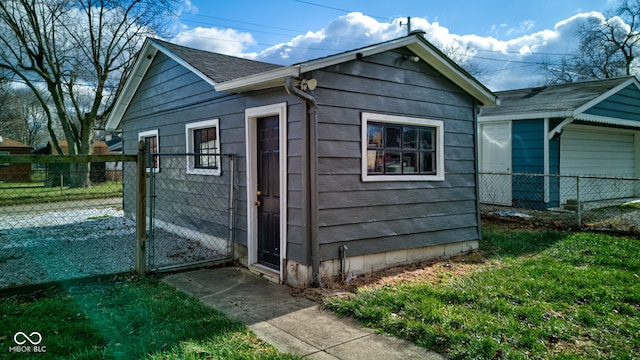 view of outbuilding featuring a lawn