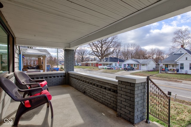 view of patio featuring a porch