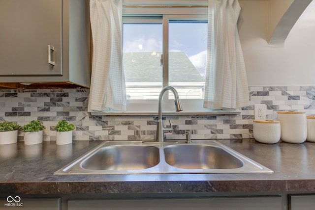 interior details with gray cabinetry and sink