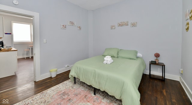 bedroom featuring dark wood-type flooring