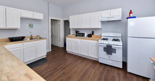 kitchen featuring white appliances, dark hardwood / wood-style flooring, and white cabinetry