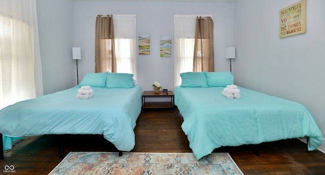 bedroom featuring dark wood-type flooring