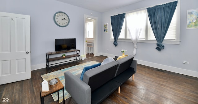 living room with dark hardwood / wood-style flooring