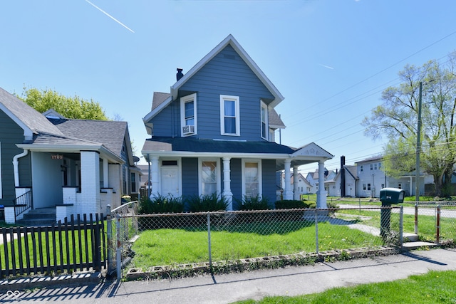 view of front of property featuring a front lawn and covered porch