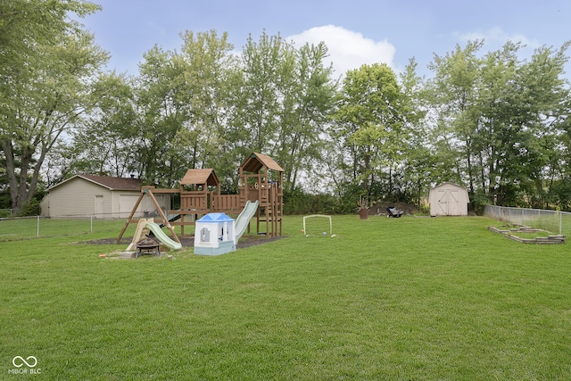 view of yard featuring a playground and a shed