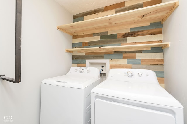 clothes washing area featuring washing machine and dryer