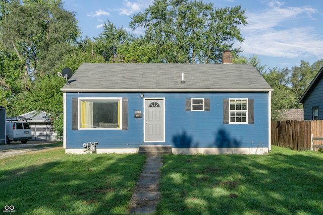 bungalow-style house featuring a front yard