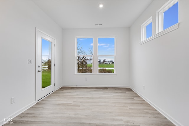 unfurnished dining area with light hardwood / wood-style flooring