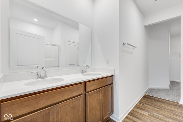 bathroom featuring vanity and hardwood / wood-style flooring