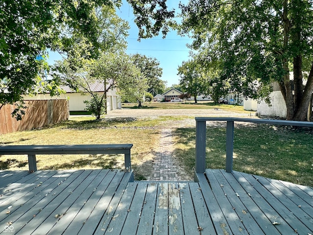 wooden terrace with a lawn