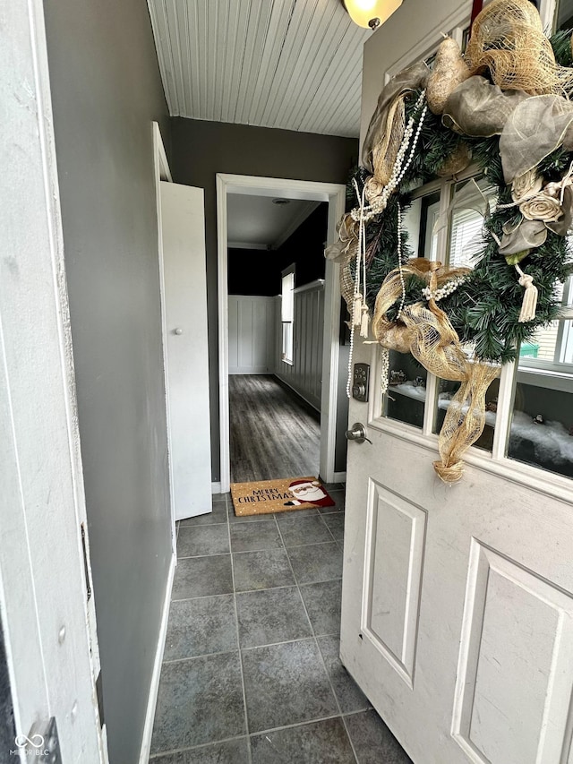 interior space featuring dark tile patterned flooring