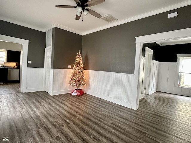 unfurnished room with hardwood / wood-style floors, ceiling fan, and crown molding