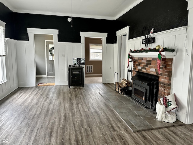 living room with crown molding and wood-type flooring