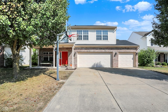 view of front of house featuring a garage and a front lawn