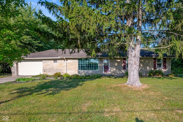 ranch-style home with a garage and a front yard