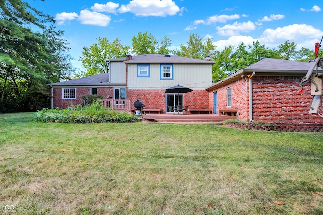 back of house with a deck and a lawn