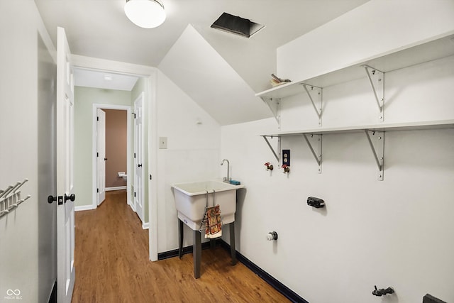 washroom with hardwood / wood-style flooring