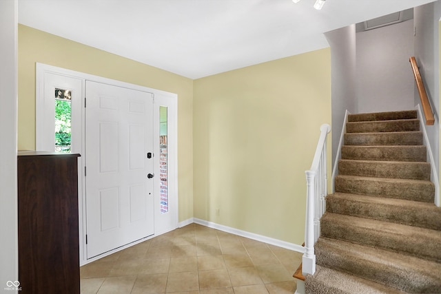 entrance foyer with light tile patterned flooring