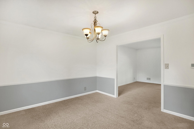 carpeted spare room with crown molding and a notable chandelier