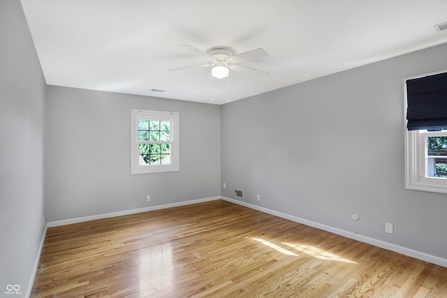 spare room featuring light wood-type flooring and ceiling fan