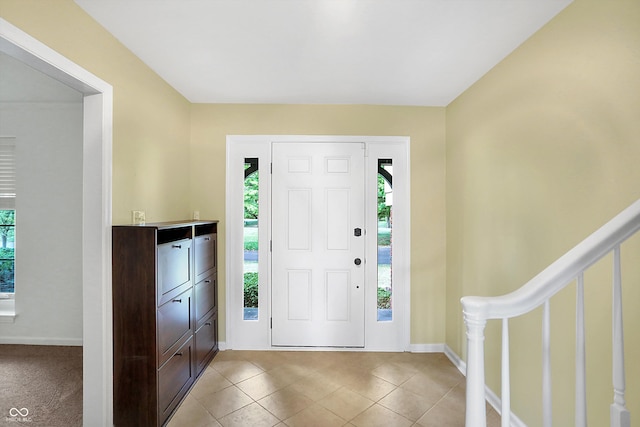 entryway featuring light tile patterned flooring