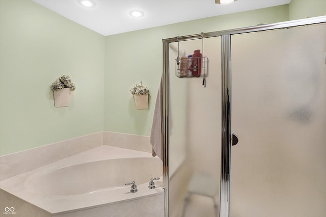 bathroom featuring plus walk in shower