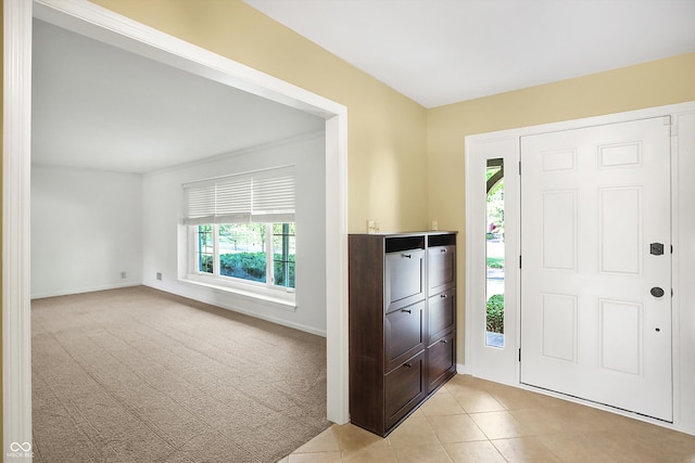 view of carpeted entrance foyer