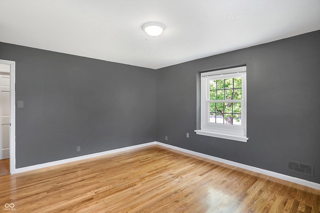 spare room with light hardwood / wood-style floors