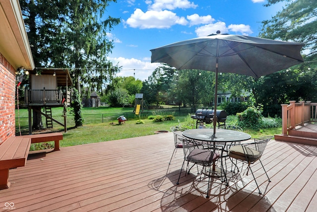 deck with a yard and grilling area