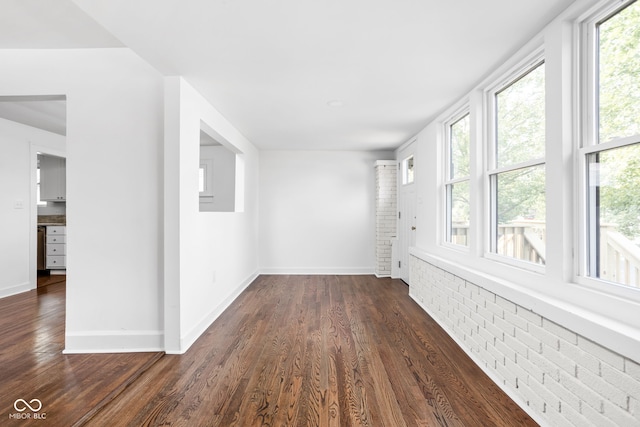 empty room featuring dark hardwood / wood-style flooring