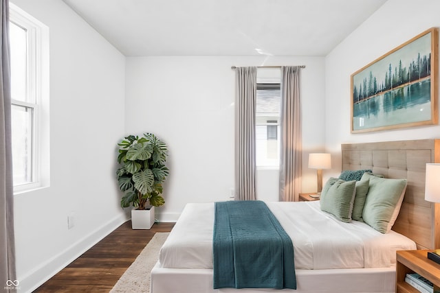 bedroom featuring dark wood-type flooring