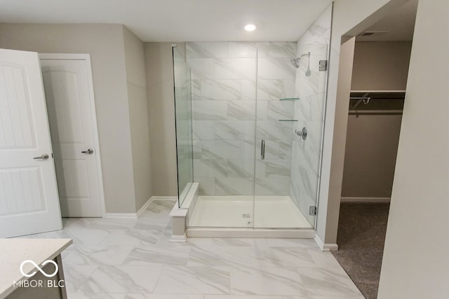 bathroom featuring vanity and an enclosed shower