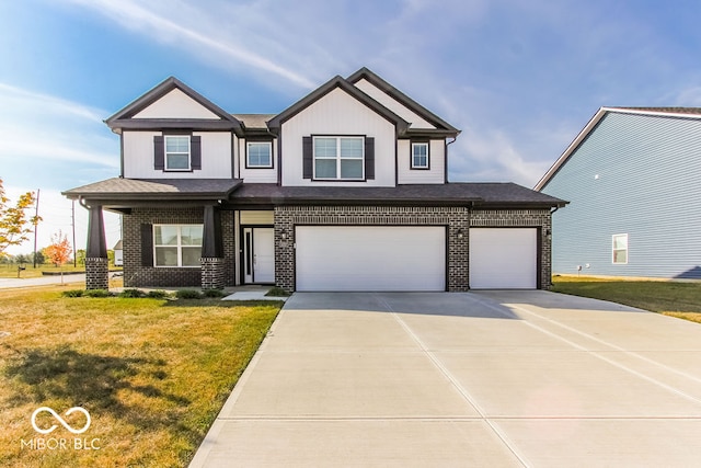 view of front of property featuring a garage and a front yard