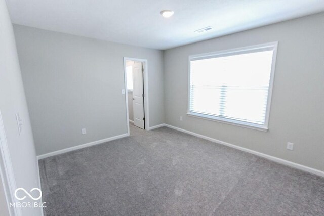 unfurnished room featuring carpet floors