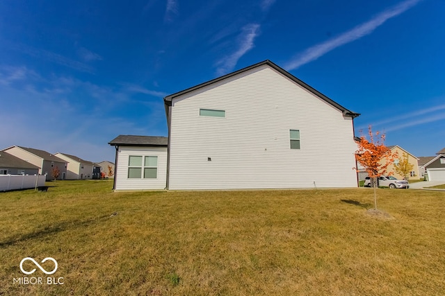 view of property exterior featuring a yard