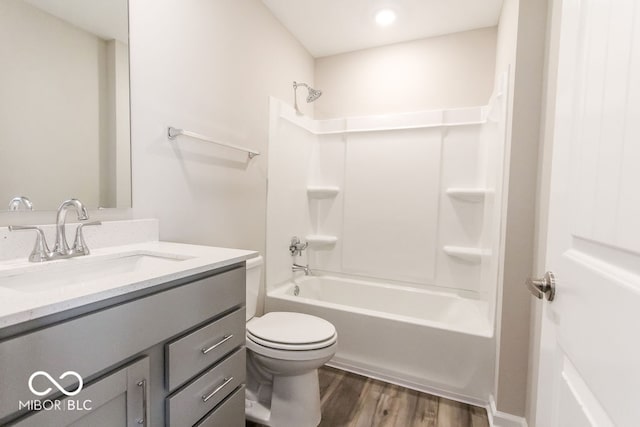 full bathroom with wood-type flooring, toilet, tub / shower combination, and vanity