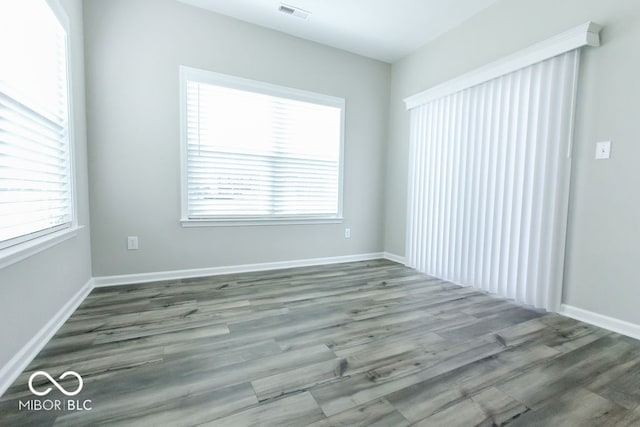 spare room with hardwood / wood-style flooring