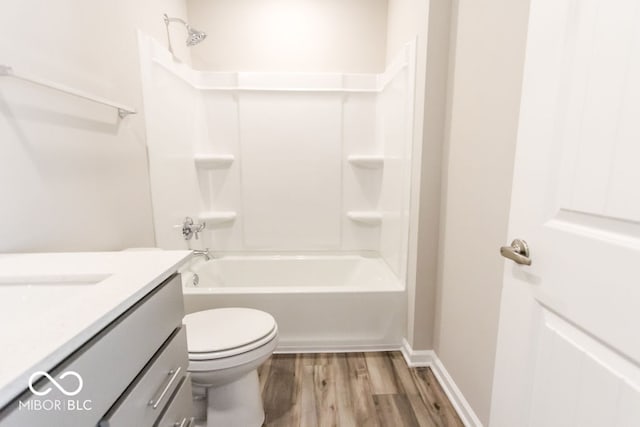 full bathroom with vanity, toilet, hardwood / wood-style floors, and shower / bath combination