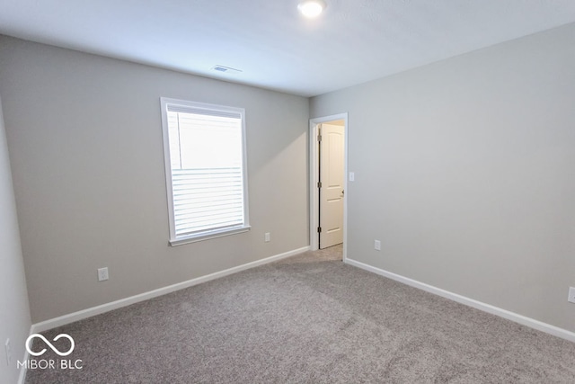 empty room with light colored carpet