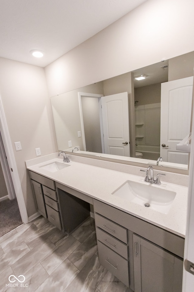 bathroom featuring vanity and shower / bathtub combination