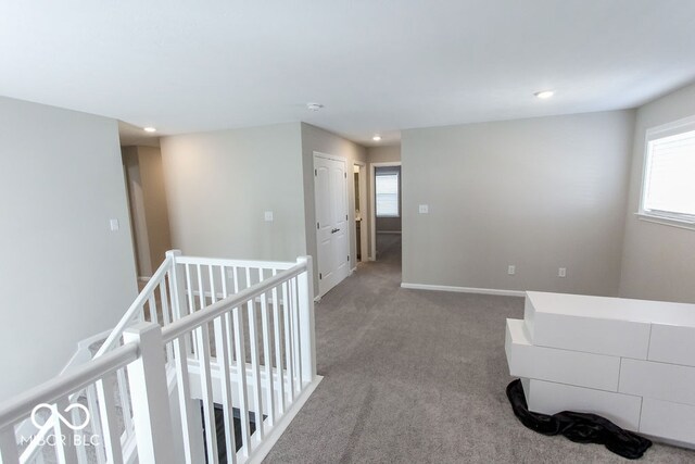 hallway with carpet